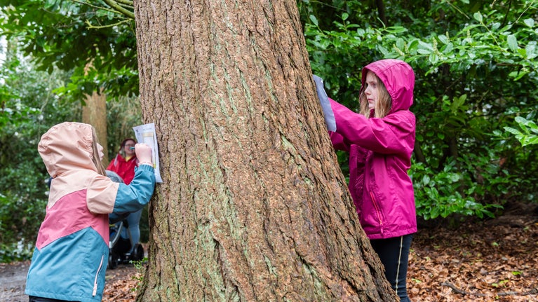 Families enjoying the Easter trail in the garden at Chirk Castle, Wrexham